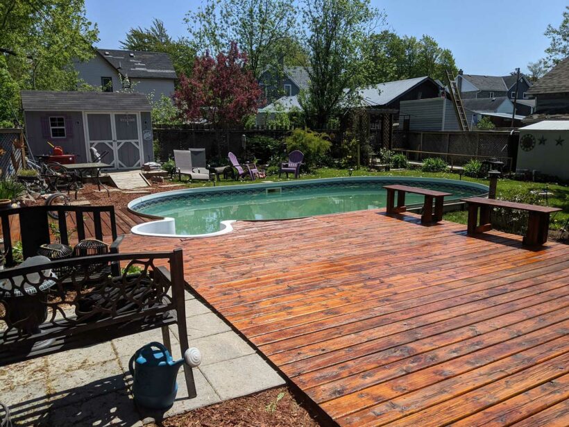 deck with pool and shed after